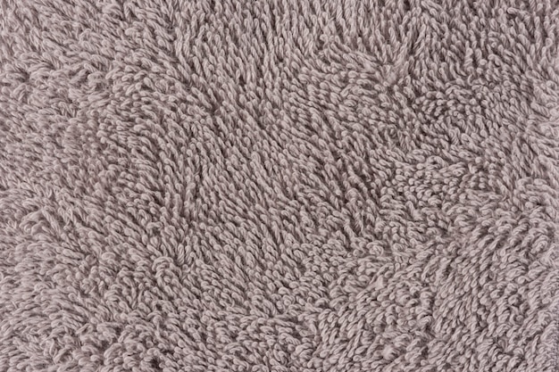 Zbliżenie brązowy ręcznik. Tekstylne szczegóły tło.