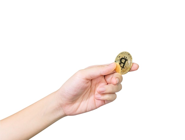 Zbliżenie dłoni trzymającej kilka sztuk złotego tokena Bitcoin Bitcoin jest jedną z popularnych kryptowalut ze ścieżką przycinającą