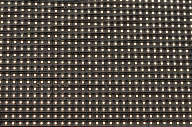 Zbliżenie ekranu informacyjnego LED Street Panel LED Wiele diod LED na czarnym tle
