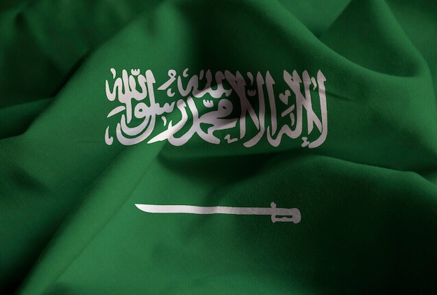 Zbliżenie potargane flagi Arabii Saudyjskiej, flaga Arabii Saudyjskiej wiejący wiatr