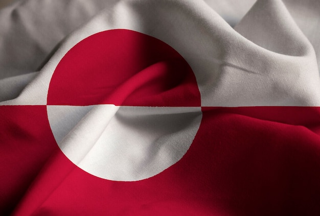 Zbliżenie potargane flagi Grenlandii, flaga Grenlandii wiejący wiatr