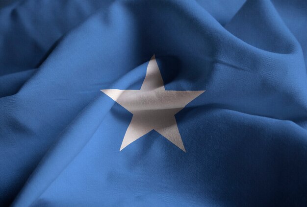 Zbliżenie potargane Somalia flaga, flaga Somalii wiejący wiatr