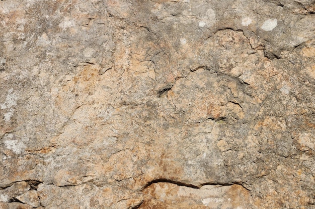 Zbliżenie szorstkiej kamiennej tekstury dużej powierzchni skalnej dla koncepcji naturalnego tła Zbliżenie brudnej tekstury tła naturalnego kamienia