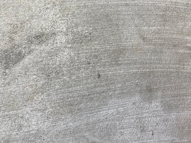 Zbliżenie teksturowanej szarej betonowej ściany