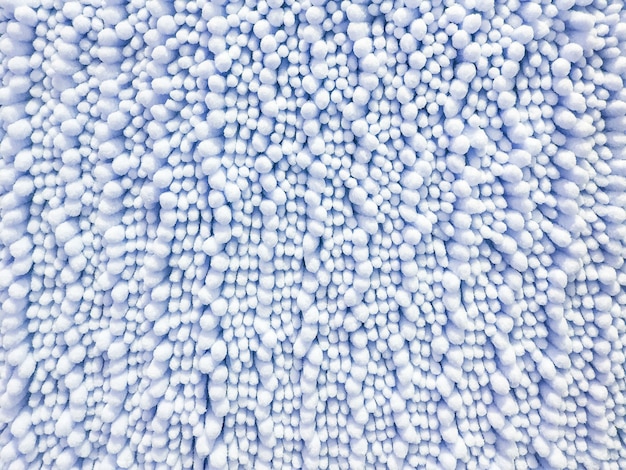 Zdjęcie zbliżenie tkaniny powierzchni abstrakcjonistyczny wzór przy błękitnym tkanina dywanem przy podłoga dom textured tło