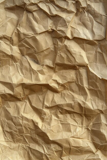 Zbliżenie zmarszczonej brązowej tekstury papieru