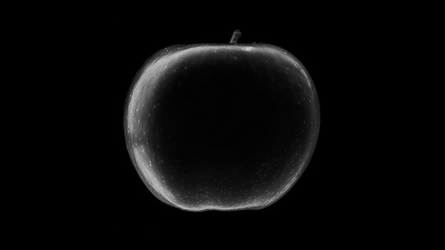 Zdjęcie czarno-białego, okrągłego jabłka na czarnym tle