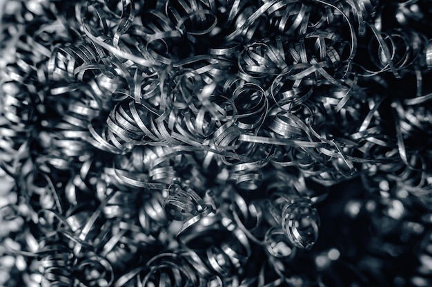 Zdjęcie Żelazne wióry metalowe loki szare metalowe tło fotografowanie makro w branży obróbki metali toczenie