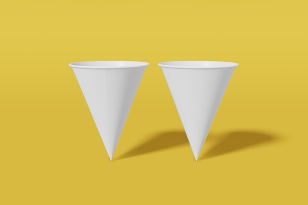 Zestaw dwóch białych papierowych makiet stożków w kształcie stożka na żółtym tle. Renderowanie 3D