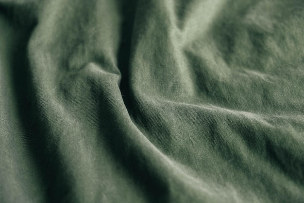 Zielona tkanina tekstura jako obraz tła. Widok z góry. Kopiuj, puste miejsce na tekst