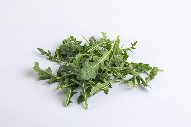 Zielony organiczny stos Arugula na tle