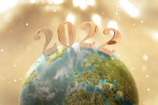Zdjęcie ziemia z 2022 i rozmytym jasnym tłem. szczęśliwego nowego roku 2022
