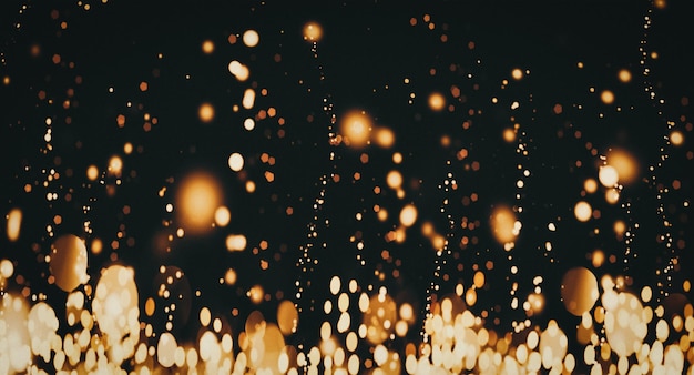 Złote cząsteczki na ciemnym tle latające błyszczące błyszczące błyszczy na czarnym sztandarze impreza świąteczna świąteczny projekt