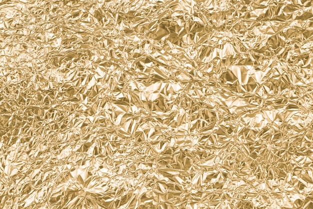 Zdjęcie złoto marszczący papierowy tekstura abstrakta tło
