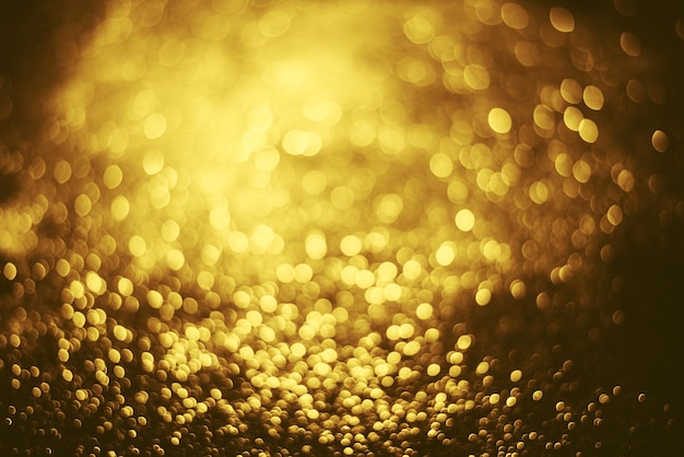 Złoty brokat tekstura oświetlenia bokeh Niewyraźne tło na urodziny rocznica ślubu sylwester lub Boże Narodzenie