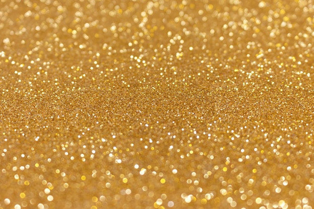 Złoty brokat tekstury tła Błyszczące nieostre świąteczne tło