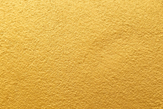 Złoty kolor ze starą grunge teksturą betonu ściany jako tło