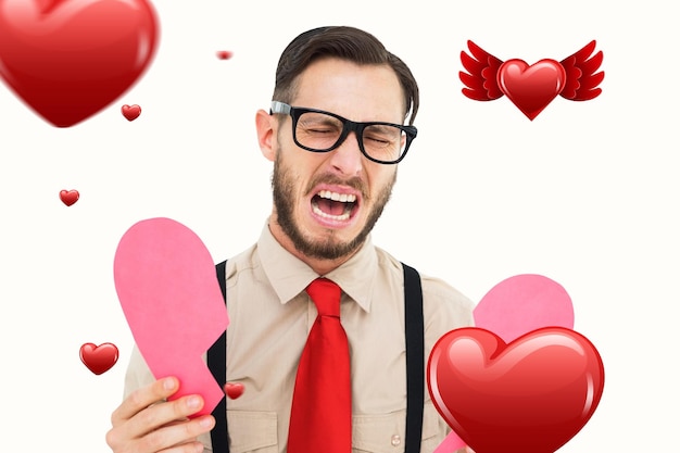 Złożony wizerunek naukowy hipster płacze i trzyma złamaną serce kartę