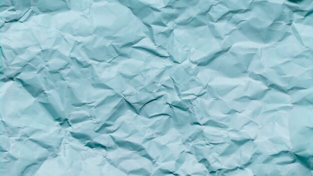 Zmięty papier tekstury tła w kolorze niebieskim