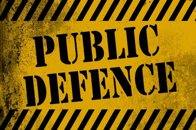 Znak obrony publicznej żółty z paskami