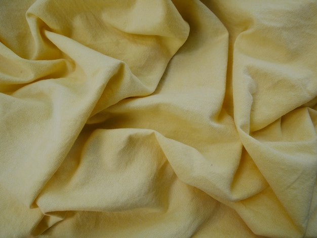 Zdjęcie Żółty jedwab bawełniany tło, tkanina tekstura tkanina