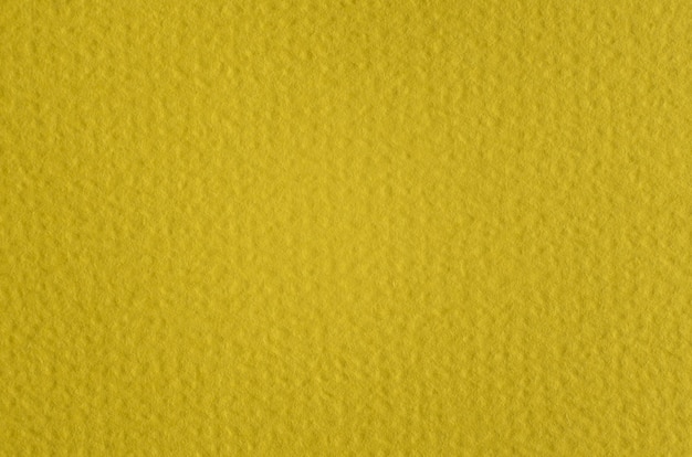 Żółty papier fotografia makro, szczegółowe tekstury nierówne tło papieru. Puste miejsce na kopię