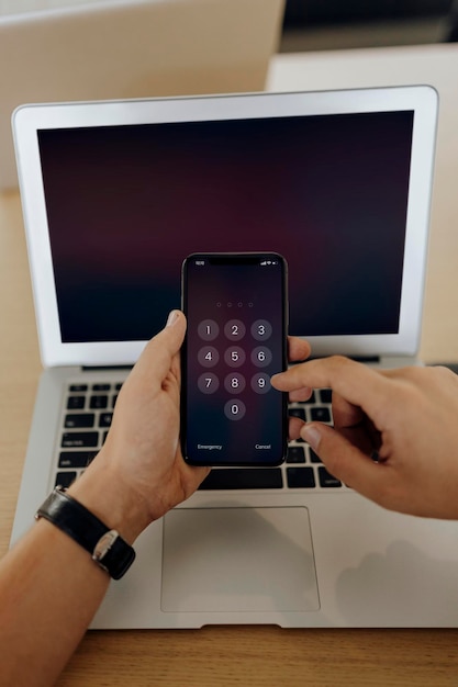 Closeup of a man unlocking a mobile phone