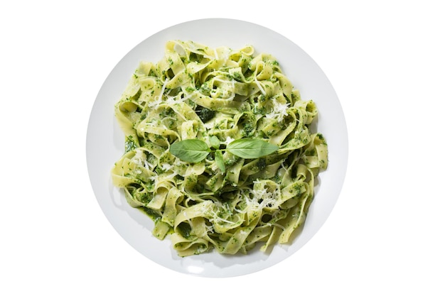 plate of pasta with pesto sauce isolated on transparent background top view