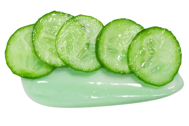 slides of fresh cucumber on a cream smear on a blank background pgn