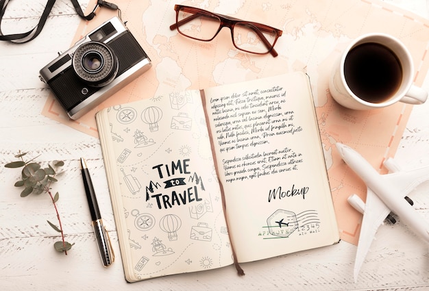 top view of agenda with coffee and camera for traveling