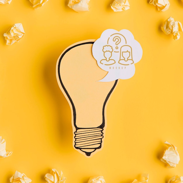 Top view of paper light bulb with chat bubble