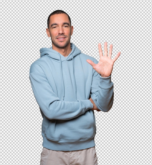 young man making a number five gesture