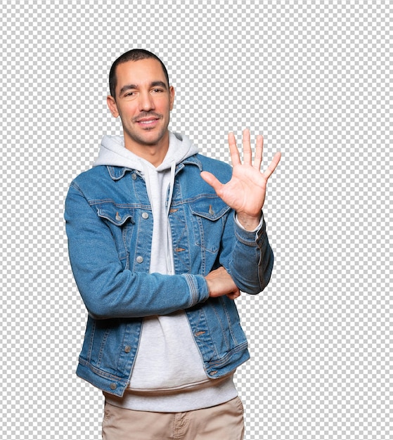 young man making a number five gesture