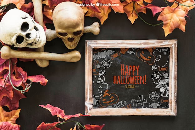 Gratis PSD halloween leisteen mockup met schedels en botten