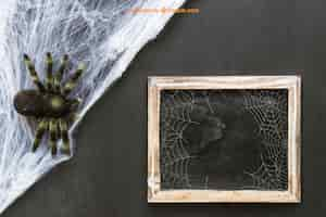 Gratis PSD halloween leisteen mockup met spinnenweb en spin