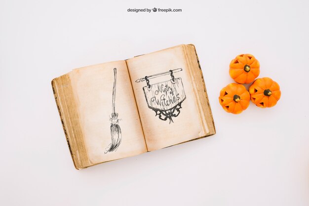 Halloween mockup con libro e zucche