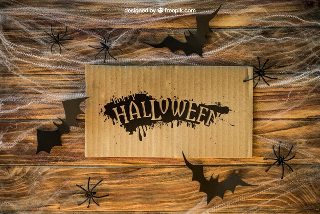 Halloween mockup met karton op spinnenweb