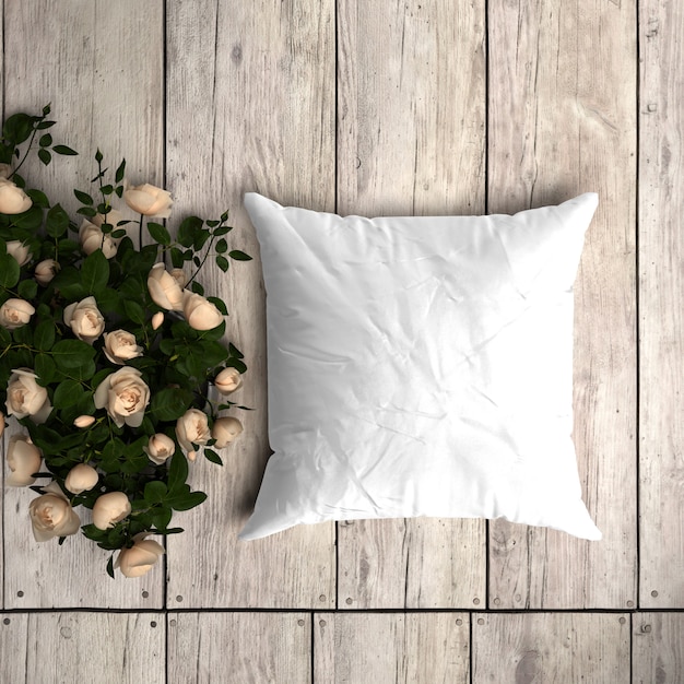 PSD gratuito maqueta de funda de almohada blanca sobre un piso de madera con rosas decorativas