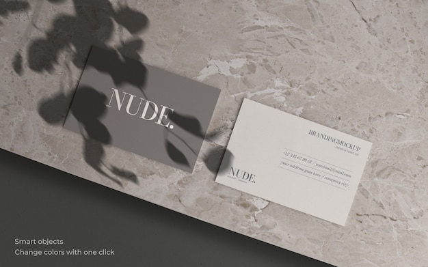 PSD gratuito maqueta de tarjeta de visita con sombra botánica y textura de mármol