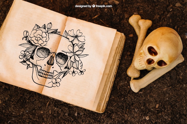 PSD gratuito mockup de halloween con cráneo y libro abierto