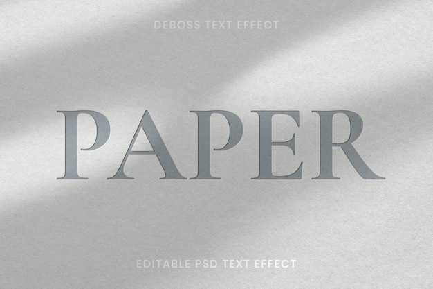 PSD gratuito plantilla editable psd de efecto de texto grabado sobre fondo de textura de papel