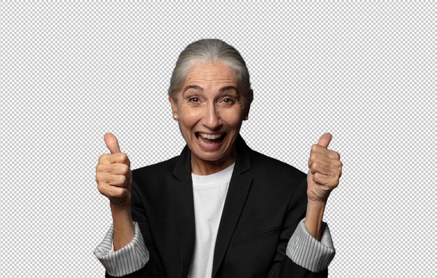 sonriendo alegremente y pareciendo feliz sintiéndose despreocupado y positivo con ambos pulgares hacia arriba