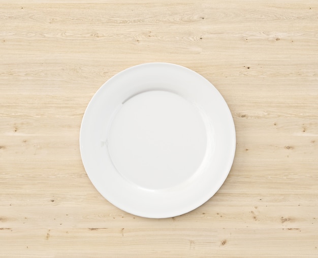 PSD gratuito vista superior plato blanco sobre mesa de madera