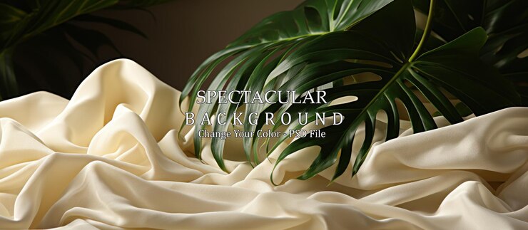 PSD gratuit des feuilles tropicales sur un tissu de satin blanc