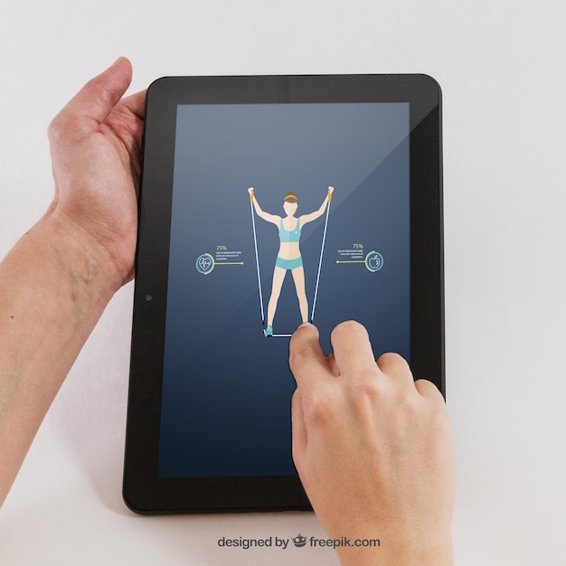 PSD gratuit main tenant la tablette avec une application sportive