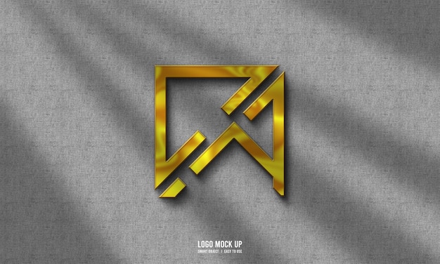 Maquette de logo doré sur mur gris