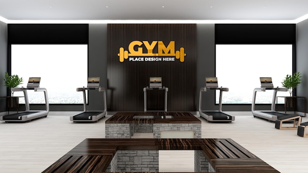 Maquette de logo de gym dans la salle de gym moderne avec décoration murale noire