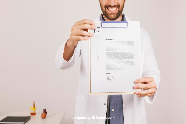 Mock up designwith happy doctor and clipboard