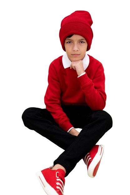 Portrait en studio de jeune fille avec bonnet rouge
