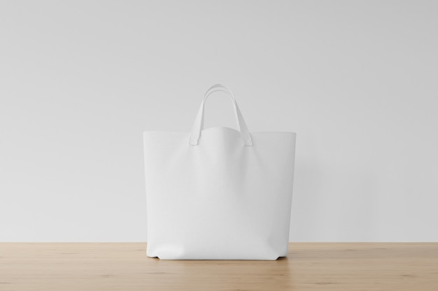 Sac blanc sur plancher en bois